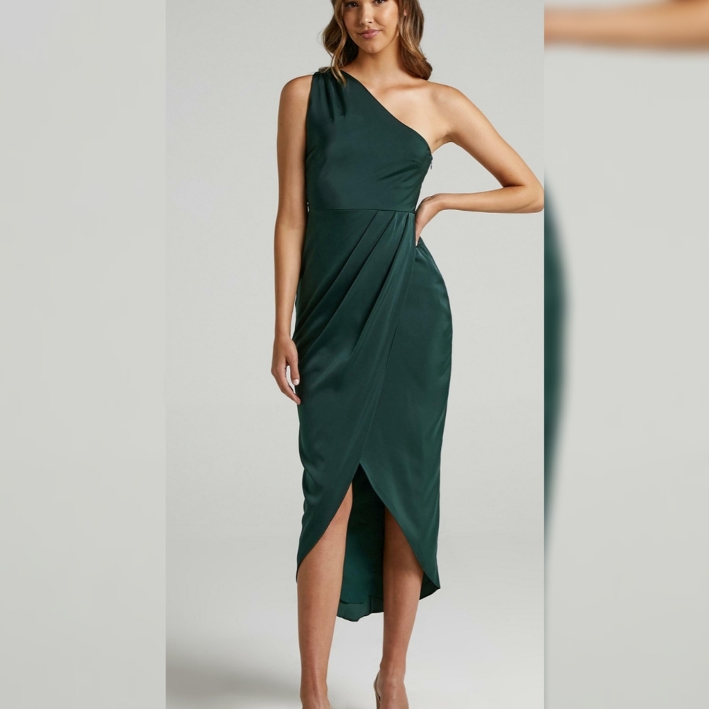 Emerald green satin dress .